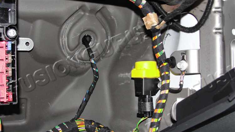Где проложен трос акпп ford fusion
