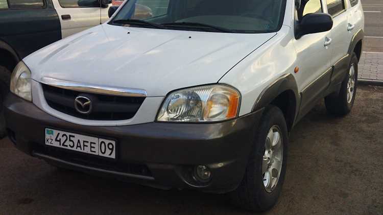 Где искать номер двигателя на Mazda Tribute с бензиновым мотором